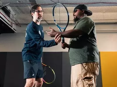 Vision Impairment No Barrier to Passionate Tennis Play