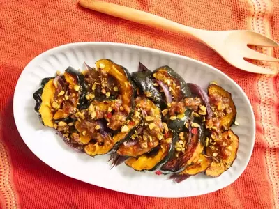 Culinary Harmony: Roasted Acorn Squash with Caramelized Red Onions and Honey-Date Vinaigrette
