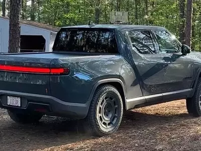 Rivian R1T's Quirky Feature: 'Carolina Squat' Achieved Through Camp Mode