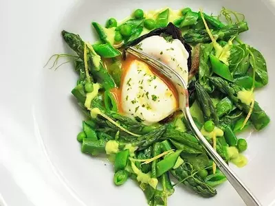 Crafting a Vibrant Spring Salad with Blanched Vegetables and Poached Eggs