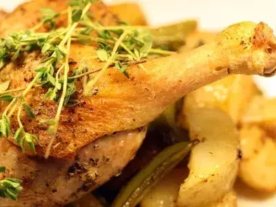 Rustic Roasted Duck Legs with New Potatoes, Sugar Snaps, and Spring Onions