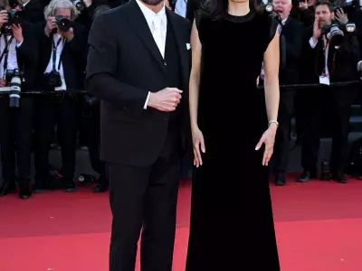 John Travolta's Cannes Style Evolution: From Acting Icon to Beret-Clad Director