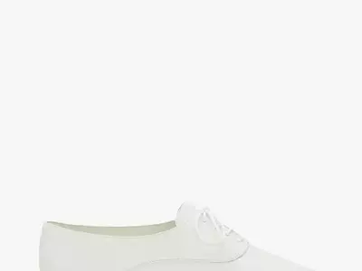 Lily Collins Embraces French-Girl Style with Classic Jazz Shoes